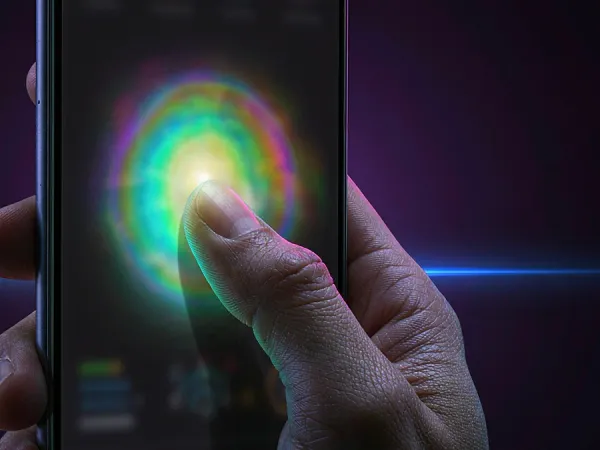 eg777 + Finger touching a glowing circle on a phone screen