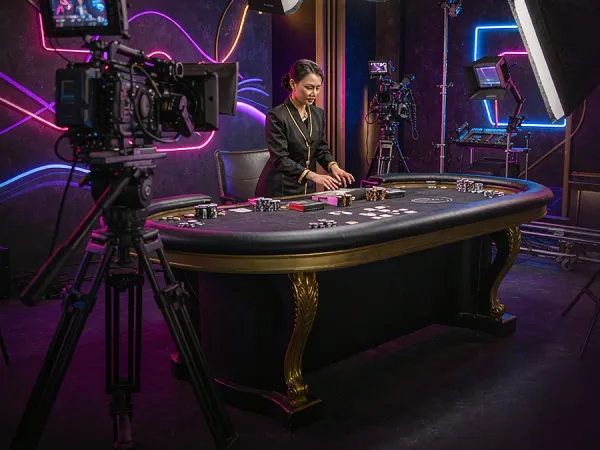 eg777 + Camera and studio lighting facing a casino table